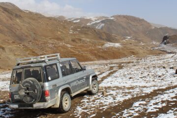 4x4 jeep navigating rugged mountain trails in the Hunza-Shimshal region, Pakistan, during an adventurous safari