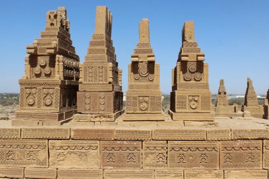 Ancient sandstone tombs at Makli Necropolis, a UNESCO World Heritage site in Pakistan.