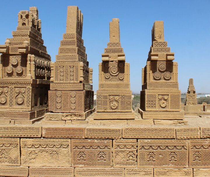 Ancient sandstone tombs at Makli Necropolis, a UNESCO World Heritage site in Pakistan.